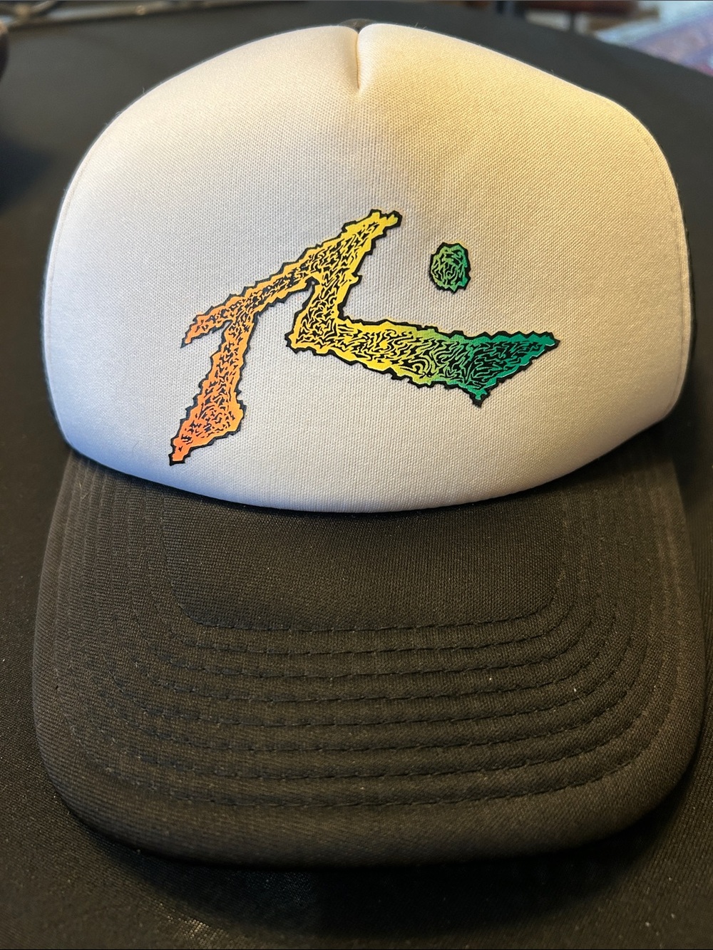 Rusty ripple trucker hat